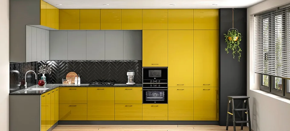 L-shaped modular kitchen with yellow and grey cabinets and tall storage